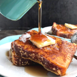 Keto French toast with butter on top and some drizzle of maple syrup