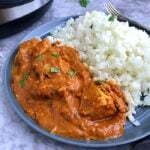 A plate of instant pot butter chicken and cauliflower rice