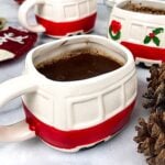 A red and white mug filled with keto hot chocolate